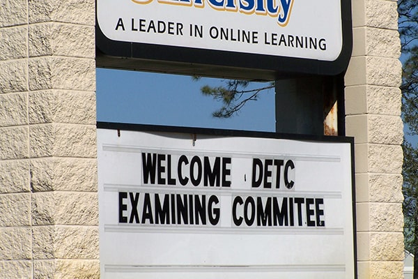 Welcome DECT Examining Committee text on CSU's signage board