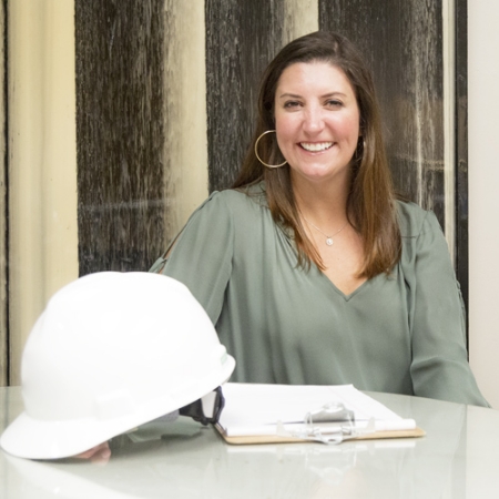 Woman with white hard hat